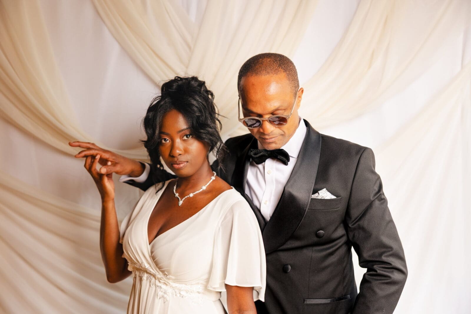 Black couple in formal wear during Black Romance London editorial at Prince of Peckham