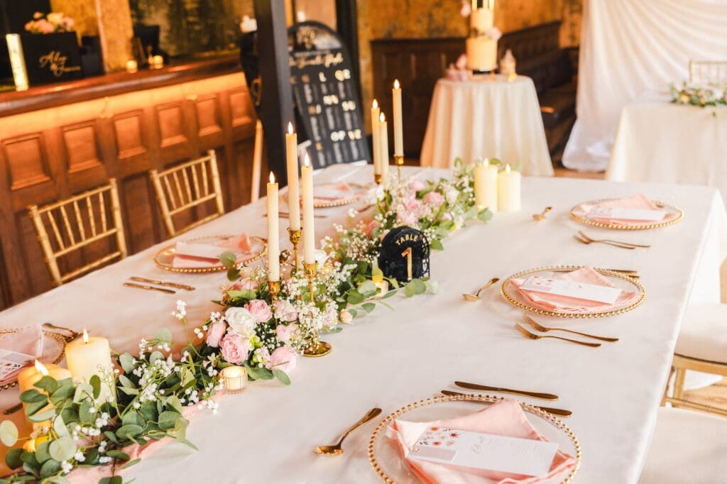 Black romance London editorial tablescape with gold candlesticks and blush florals at Prince of Peckham