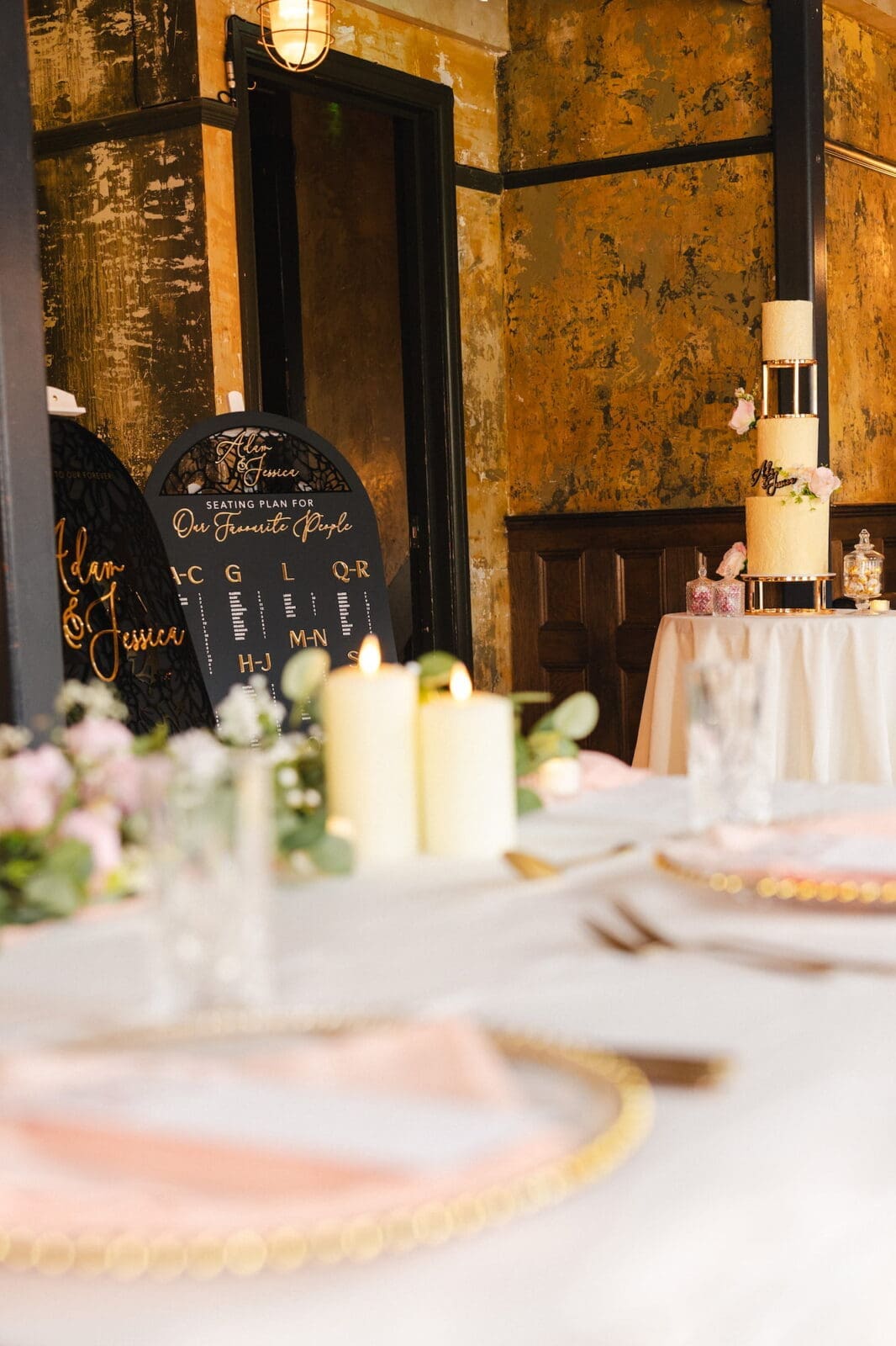 Black romance London editorial venue styling with acrylic seating plan and wedding cake at Prince of Peckham