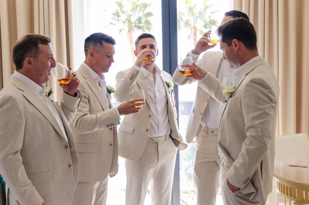 Michael and his four groomsmen sharing a whisky before the wedding ceremony at Hotel Don Pepe Gran Meliá in Marbella.