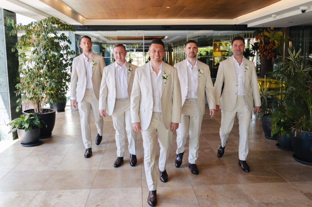 Michael leads his four groomsmen through the lobby of Hotel Don Pepe Gran Meliá before the wedding ceremony in Marbella.