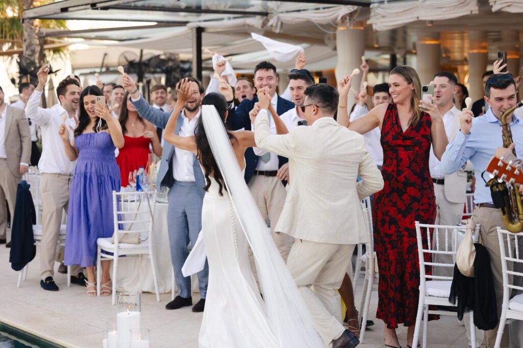 Anna and Michael making their way through their wedding guests as the band continues to play
