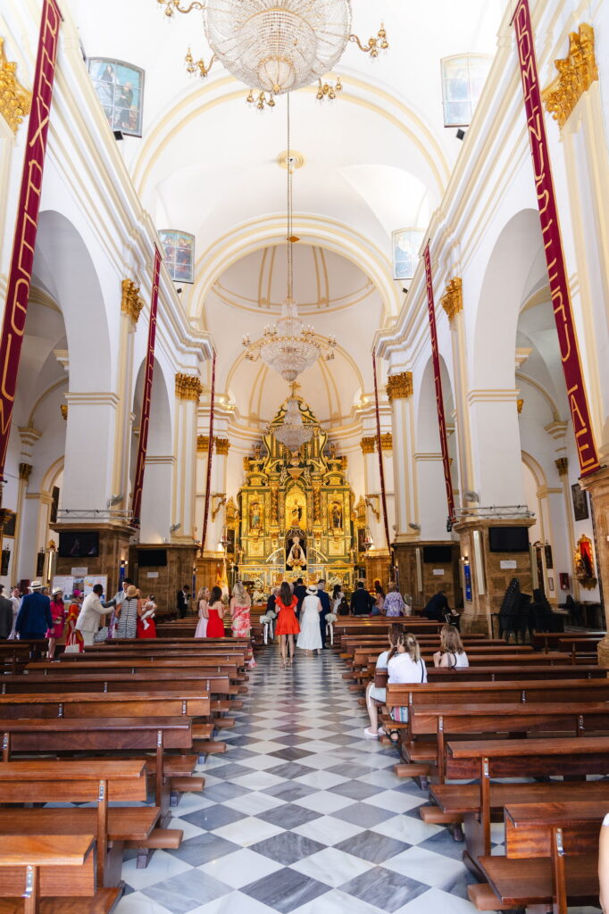 Guests gather at the front of Iglesia de la Encarnación before Anna and Michael's wedding ceremony in Marbella.